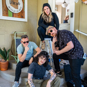 A group of people posing outside