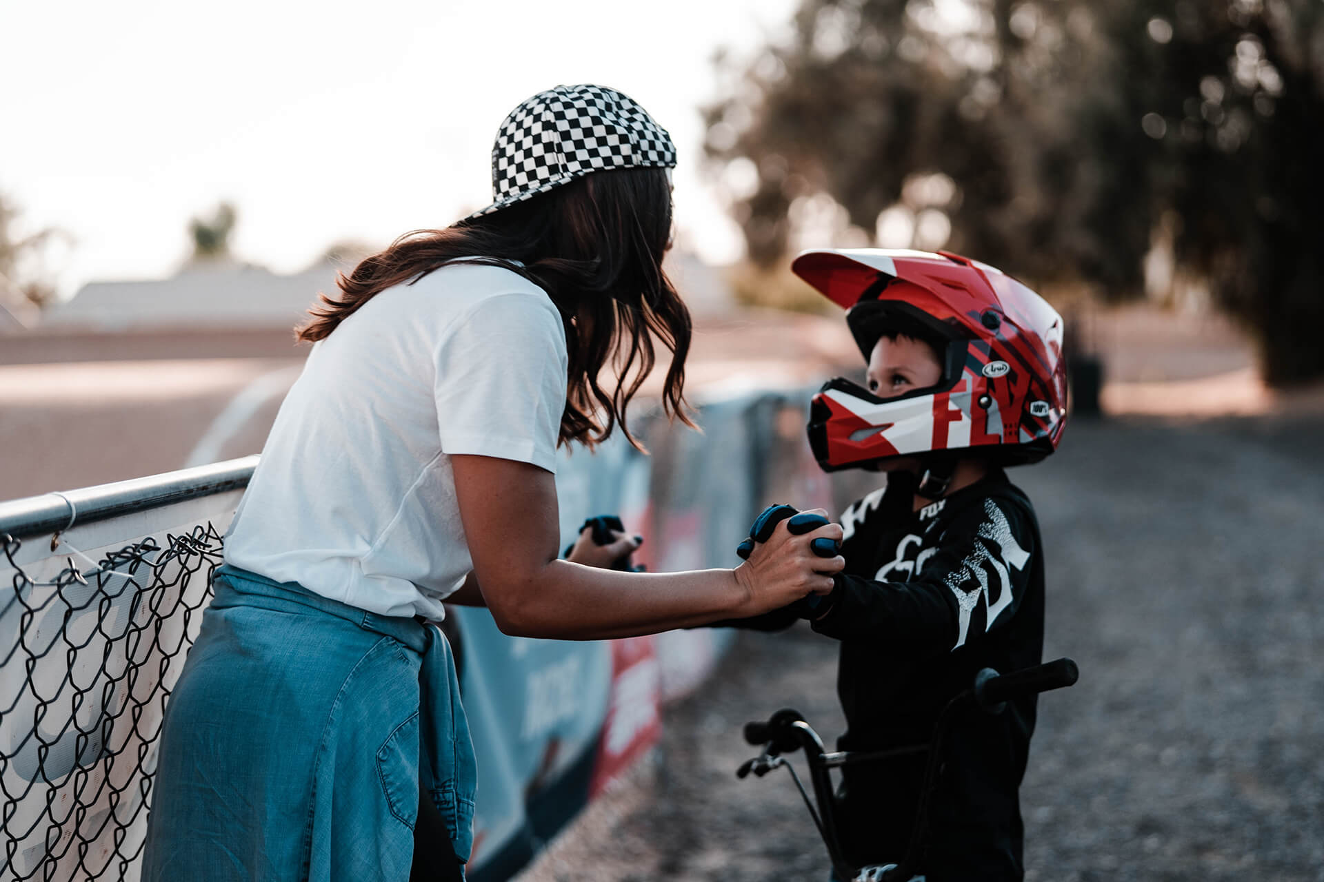 Young boy in bmx helmet with his mom