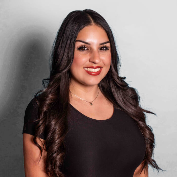 Headshot of a women in a black shirt | Rochelle Perez