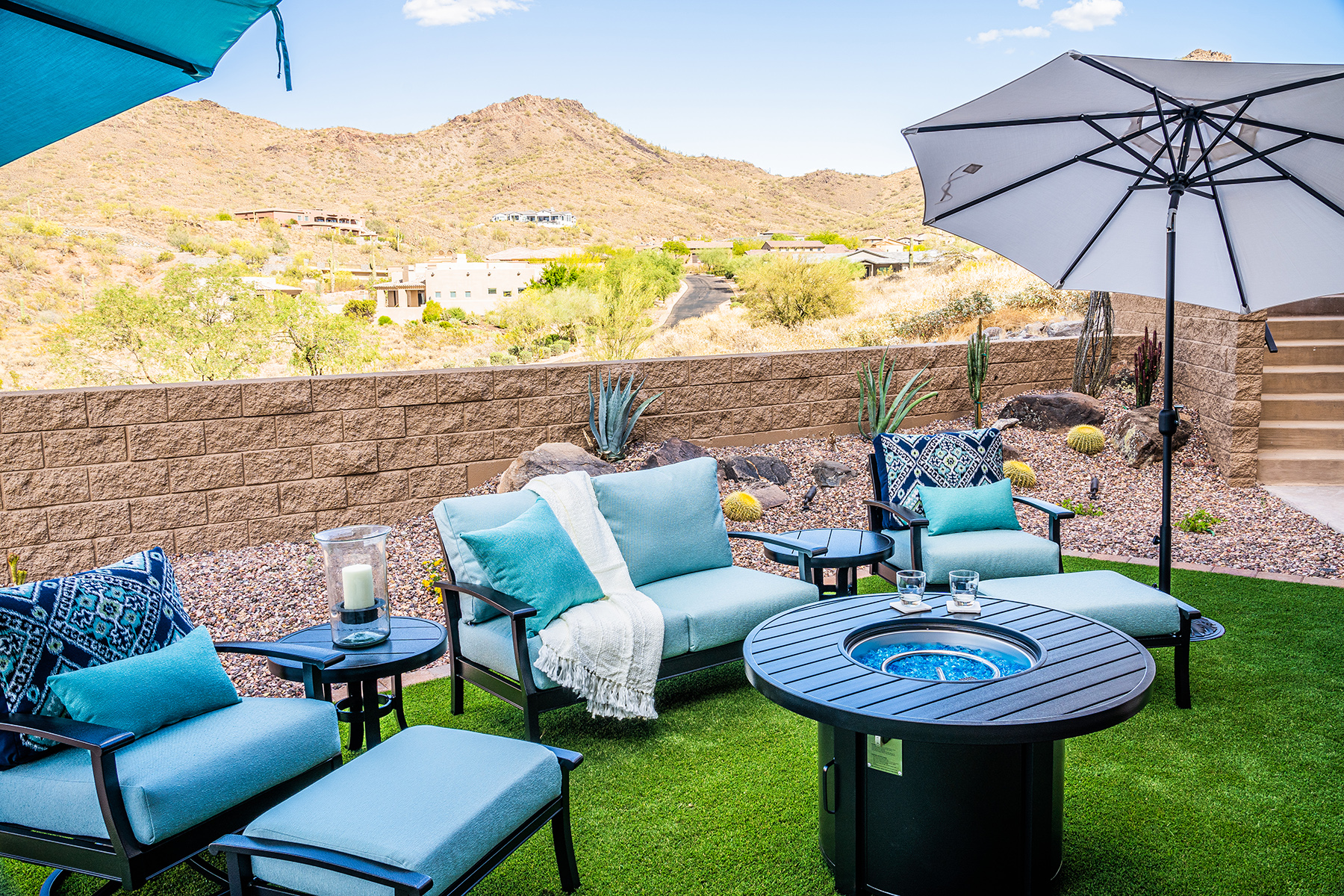 outdoor chairs and couch in a backyard