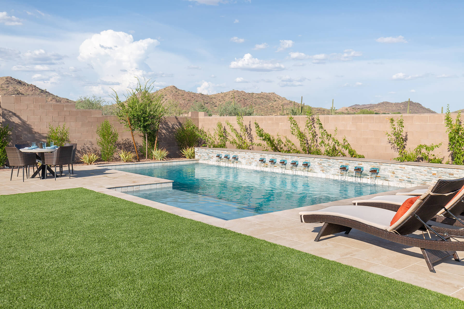 Lounge Chairs next to a pool