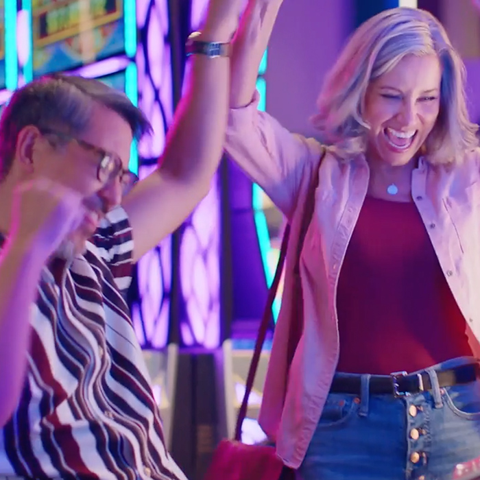 People celebrating at a slot machine