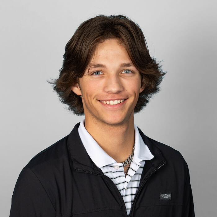 Headshot of man in black shirt