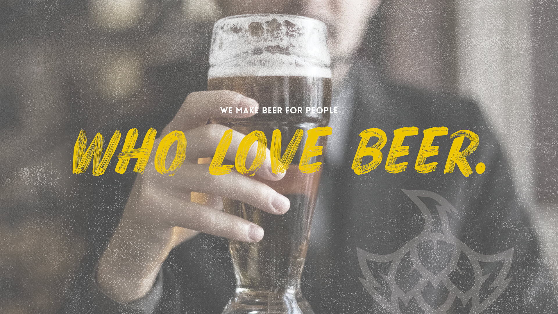 Someone holding a glass of beer