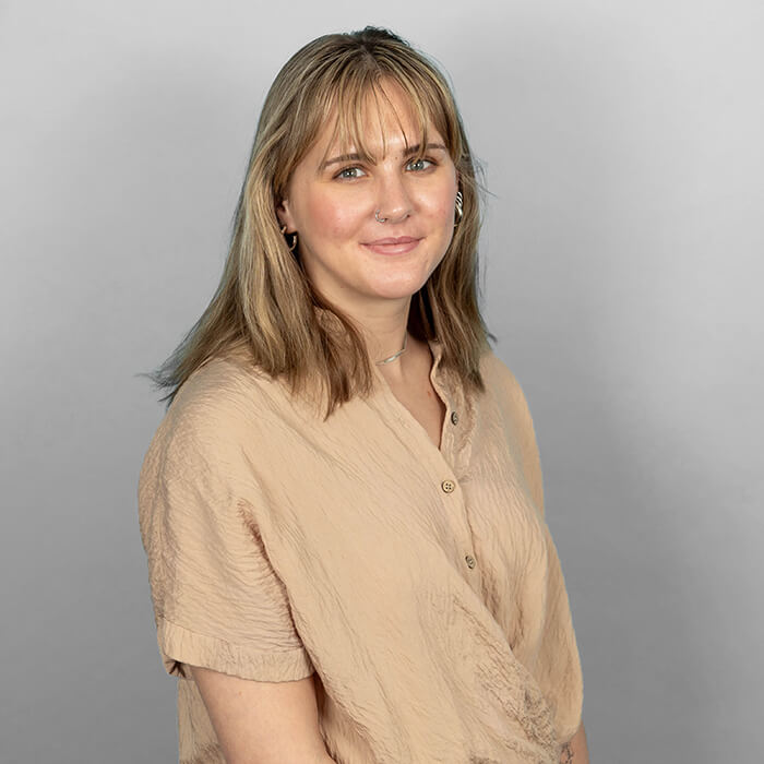 Headshot of a women in a tan top