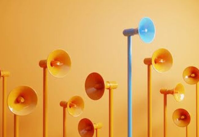 Orange and Blue megaphones on a orange background