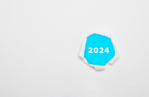 White screen with a ripped 'hole' showing '2024'